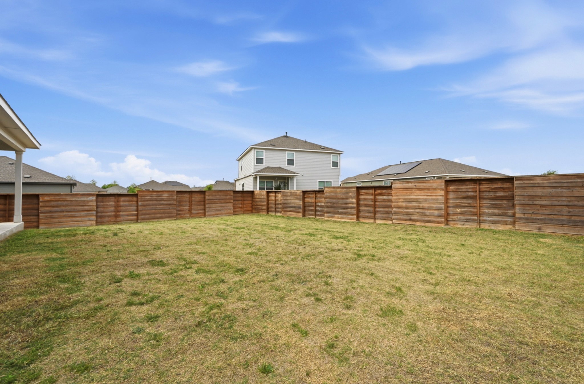 388 Barcelona Kyle, TX 78640 - Photo 24 of 26 a view of a big house with a outdoor space