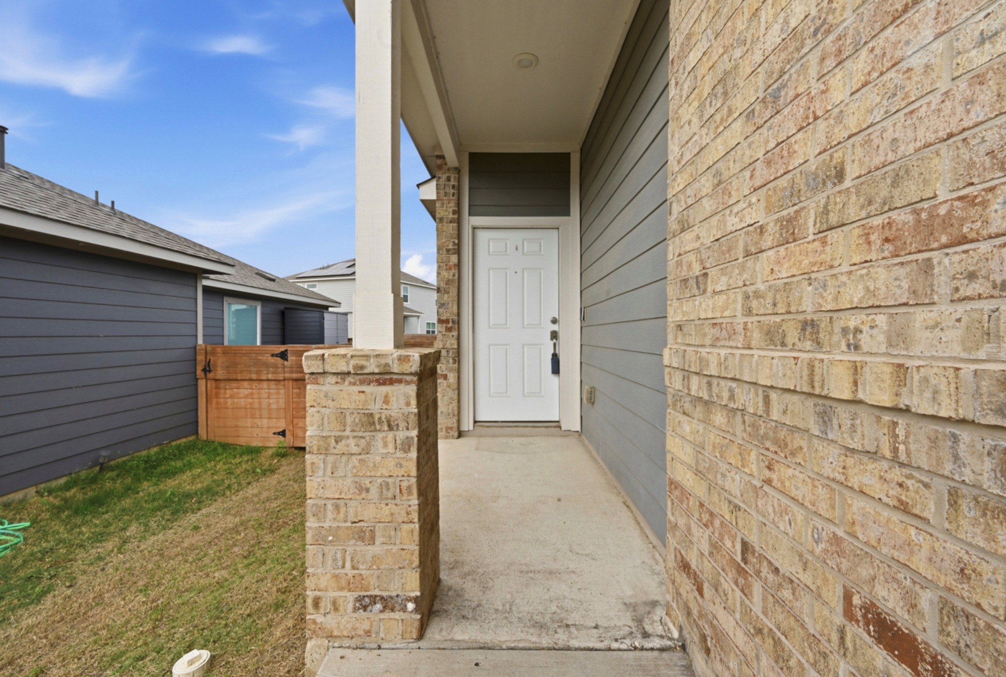 388 Barcelona Kyle, TX 78640 - Photo 3 of 26 a view of a door and brick wall