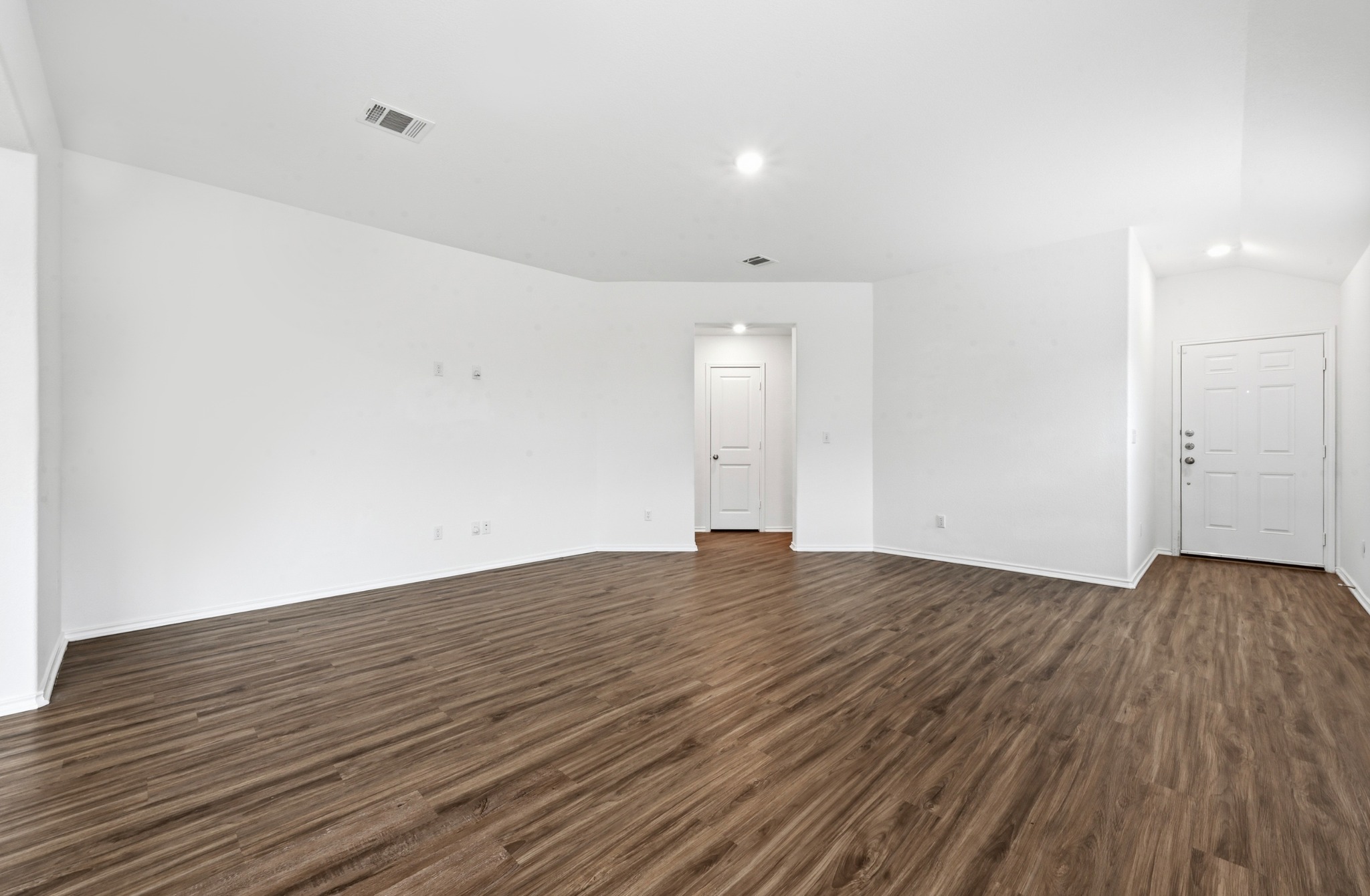 388 Barcelona Kyle, TX 78640 - Photo 7 of 26 a view of an empty room with wooden floor and closet