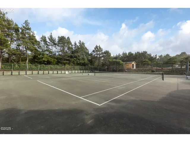 a view of an outdoor space and tennis court