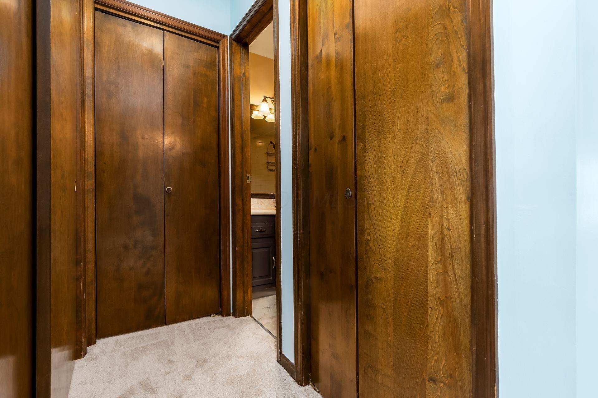 4765 Coach Road Columbus, OH 43220 - Photo 29 of 47 Hall to primary bathroom; 2 clothes and 1 linen closet