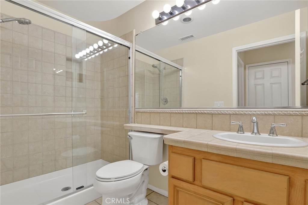 20543 Pesaro Porter Ranch Porter Ranch, CA 91326 - Photo 58 of 67 a bathroom with a sink a toilet and shower