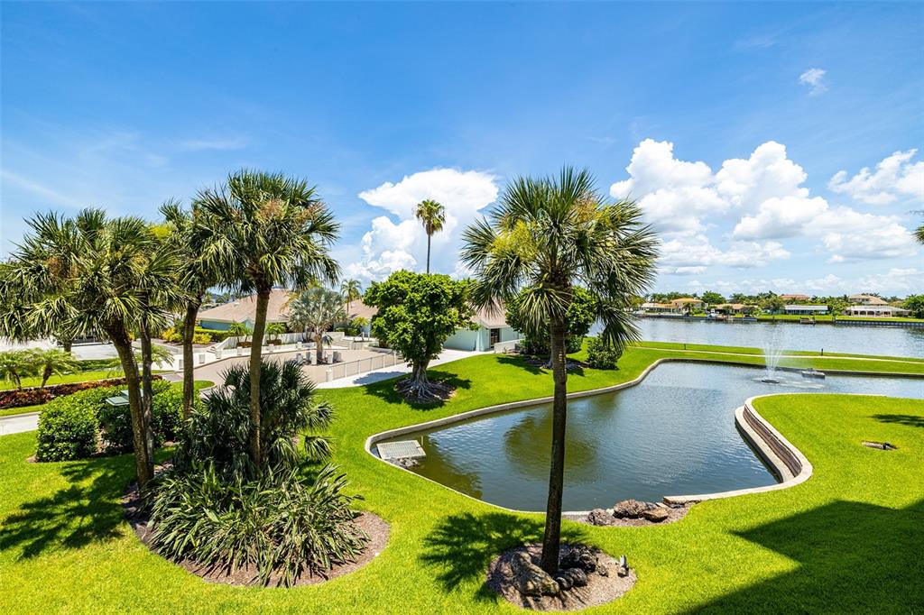 9425 Blind Pass Road, Unit 203 St. Pete Beach, FL 33706 - Photo 1 of 1 Balcony offers view of pond with intracoastal beyond
