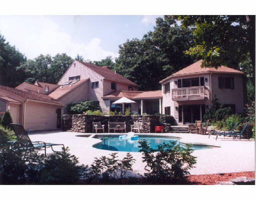 985 North Road Carlisle, MA 01741 - Photo 1 of 1 a front view of a house with yard and green space