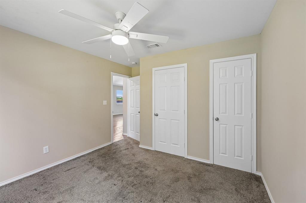 433 Whitney Court Rio Vista, TX 76093 - Photo 24 of 27 an empty room with closet and a ceiling fan