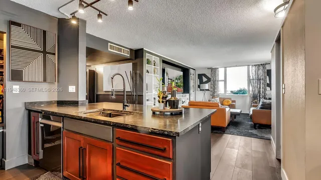 a view of living room with granite countertop furniture and a large window