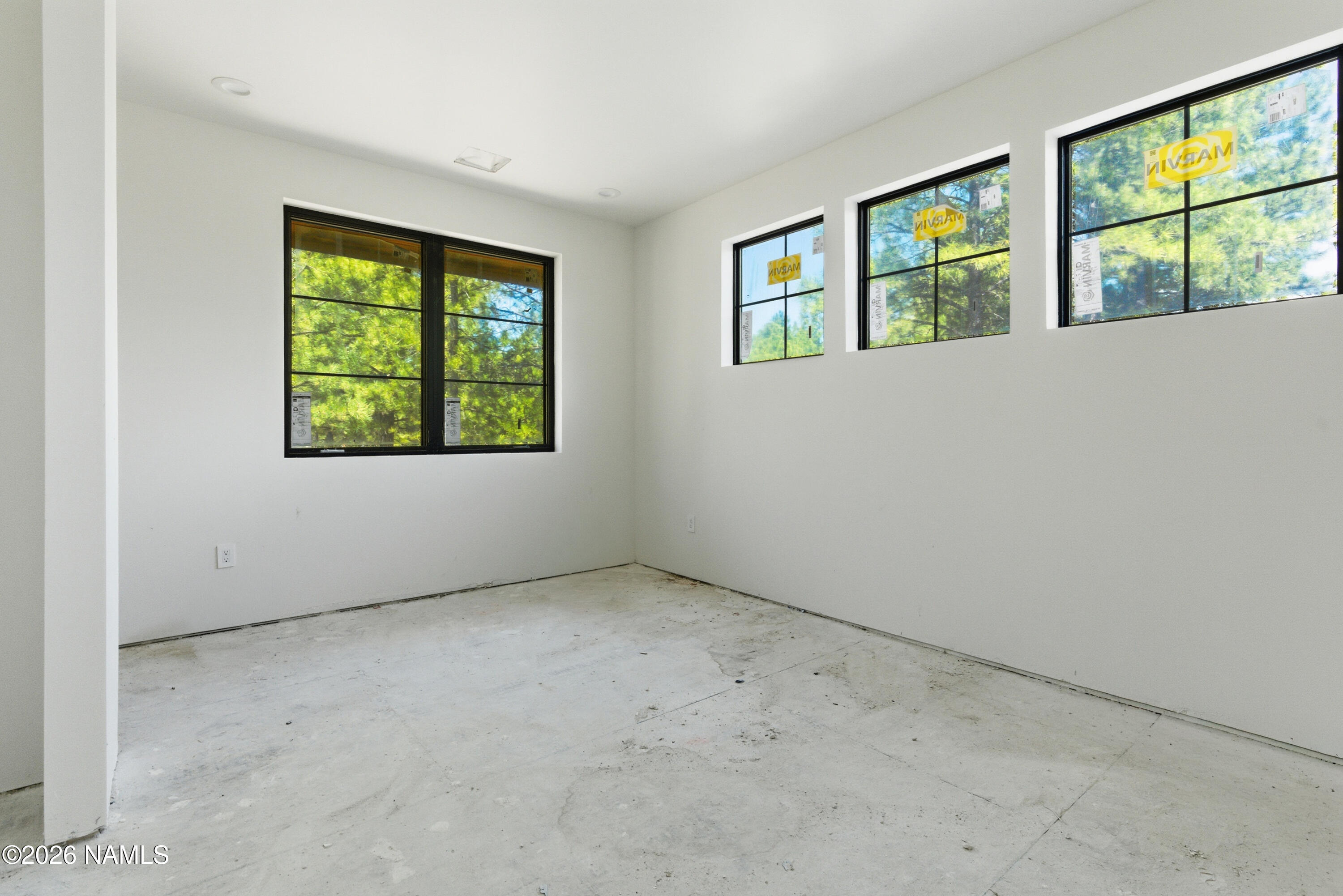 2380 East Del Rae Drive Flagstaff, AZ 86005 - Photo 14 of 26 an empty room with windows
