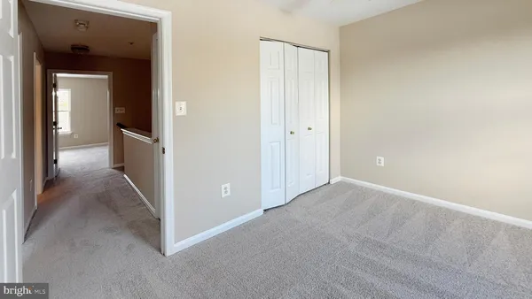 a view of a bathroom from a hallway