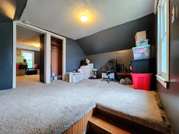 a bed room with a bed and a tv