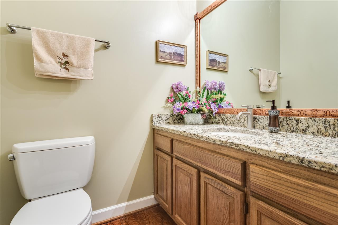 8108 Mourning Dove Road Raleigh, NC 27615 - Photo 17 of 25 RECENTLY UPDATED DOWNSTAIRS SPACIOUS POWDER ROOM WITH GRANITE COUNTERTOPS. Bathroom
