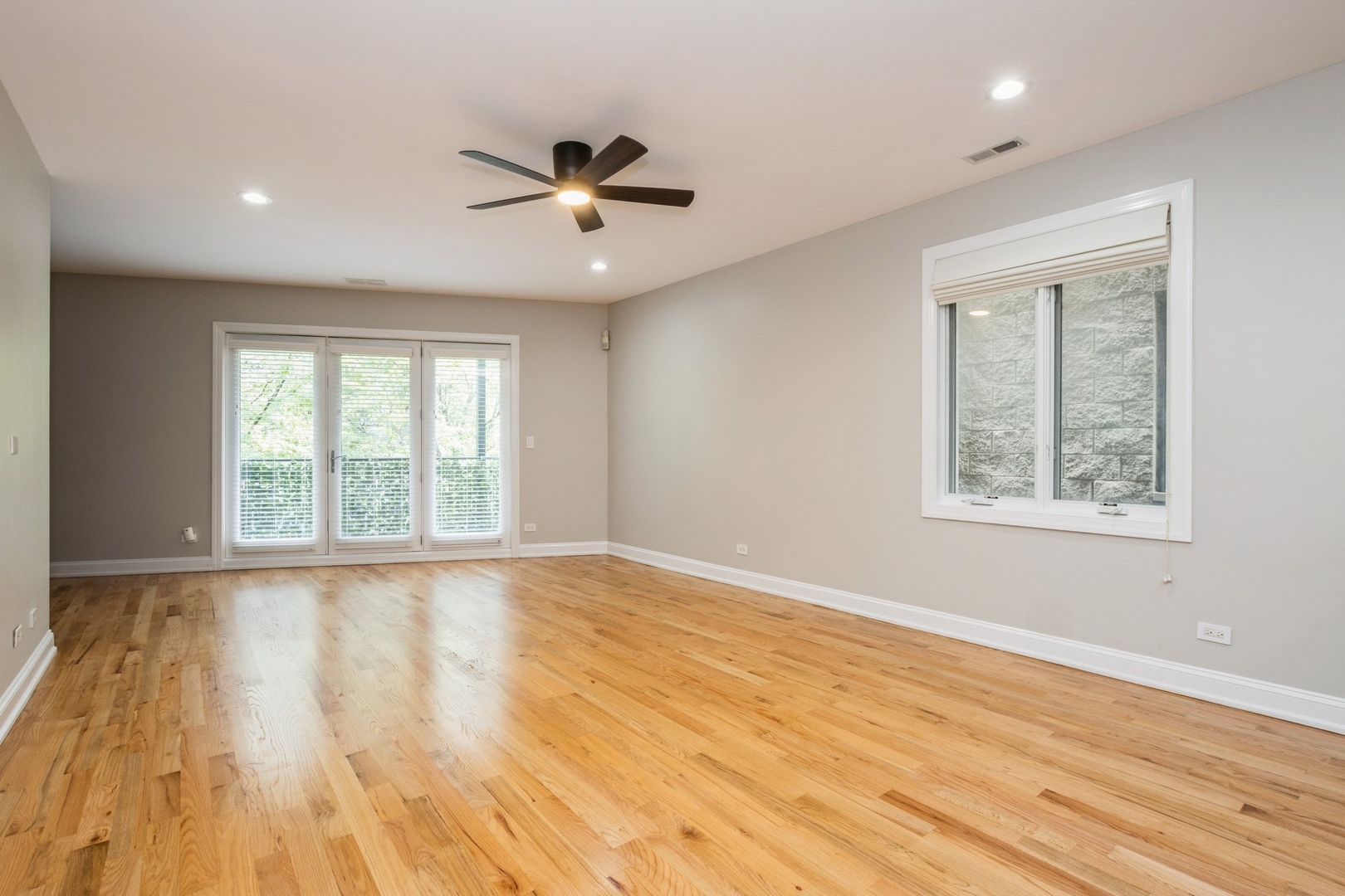 21 East 26th Street, Unit 3 Chicago, IL 60616 - Photo 3 of 21 a view of an empty room with wooden floor and a window
