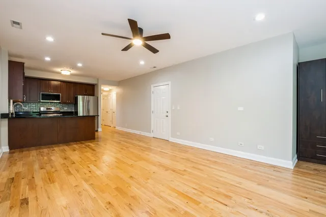a view of kitchen with wooden floor