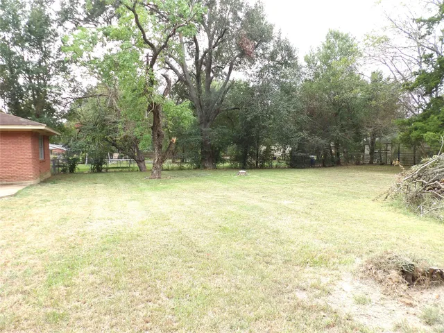 a view of a swimming pool and a yard