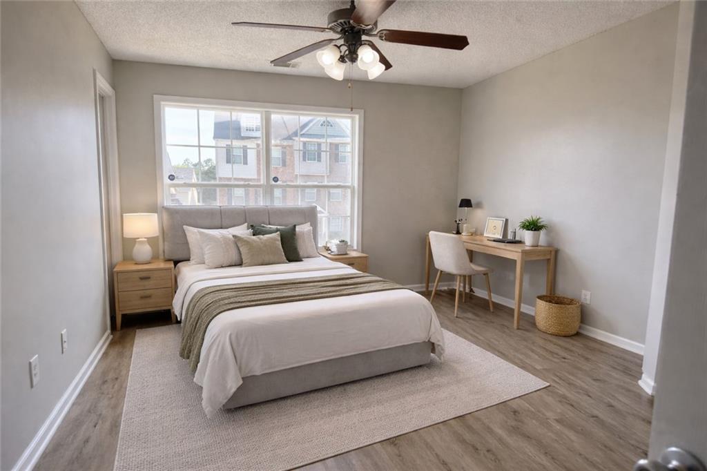 6370 Olmadison Place Atlanta, GA 30349 - Photo 12 of 15 a bedroom with a bed and a window
