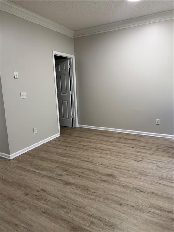 6370 Olmadison Place Atlanta, GA 30349 - Photo 15 of 15 wooden floor in an empty room