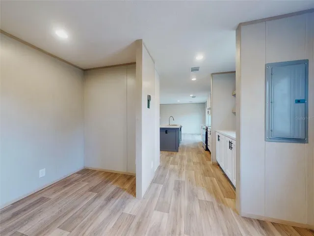 a view of a kitchen with wooden floor