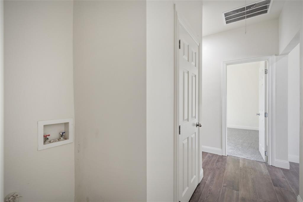 1905 South Walnut Street Sherman, TX 75090 - Photo 16 of 22 a view of a hallway with wooden floor