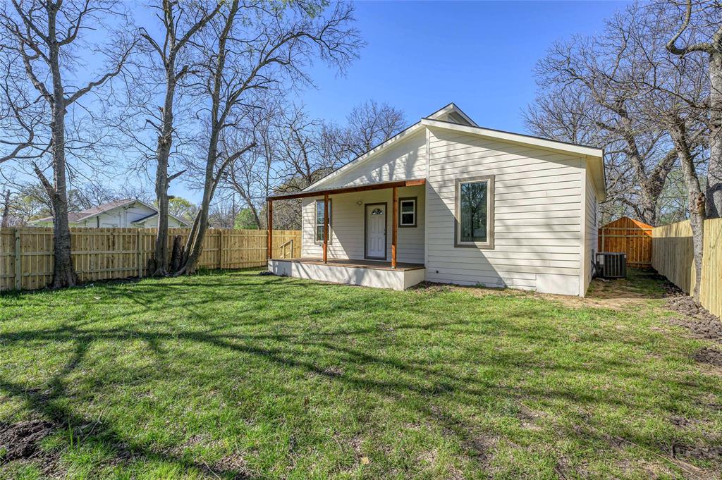 1905 South Walnut Street Sherman, TX 75090 - Photo 21 of 22 a view of a house with a small yard and large tree
