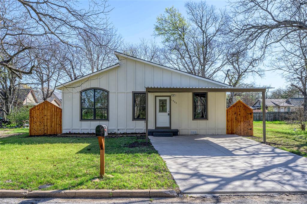 1905 South Walnut Street Sherman, TX 75090 - Photo 3 of 22 a front view of a house with garden