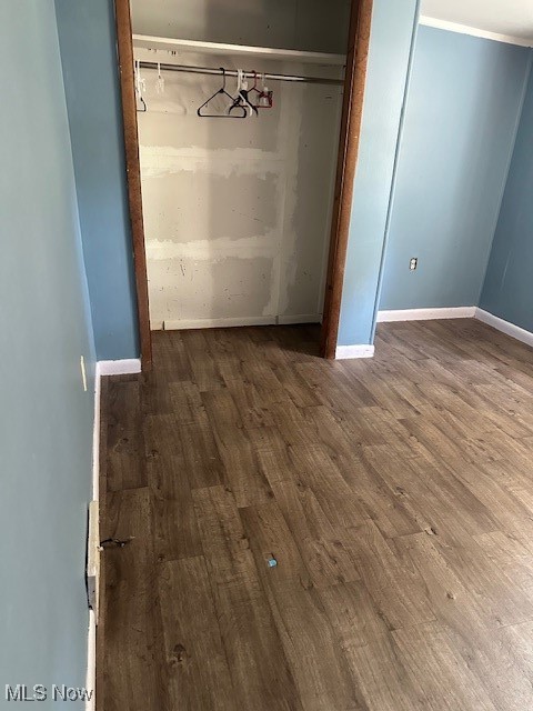 3100 Powell Road Kent, OH 44240 - Photo 3 of 15 Unfurnished bedroom featuring dark wood-type flooring and baseboards