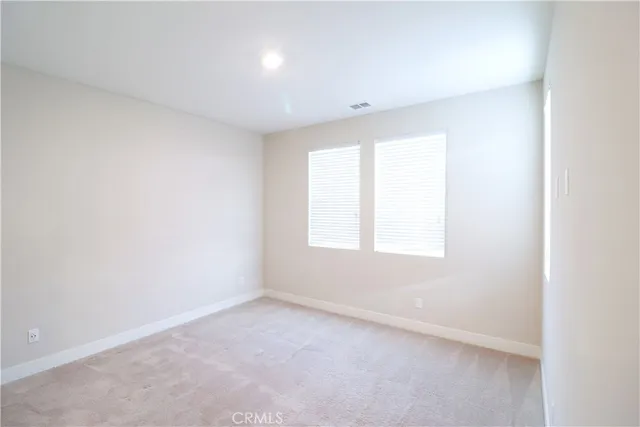 a view of a bathroom with a sink and a mirror