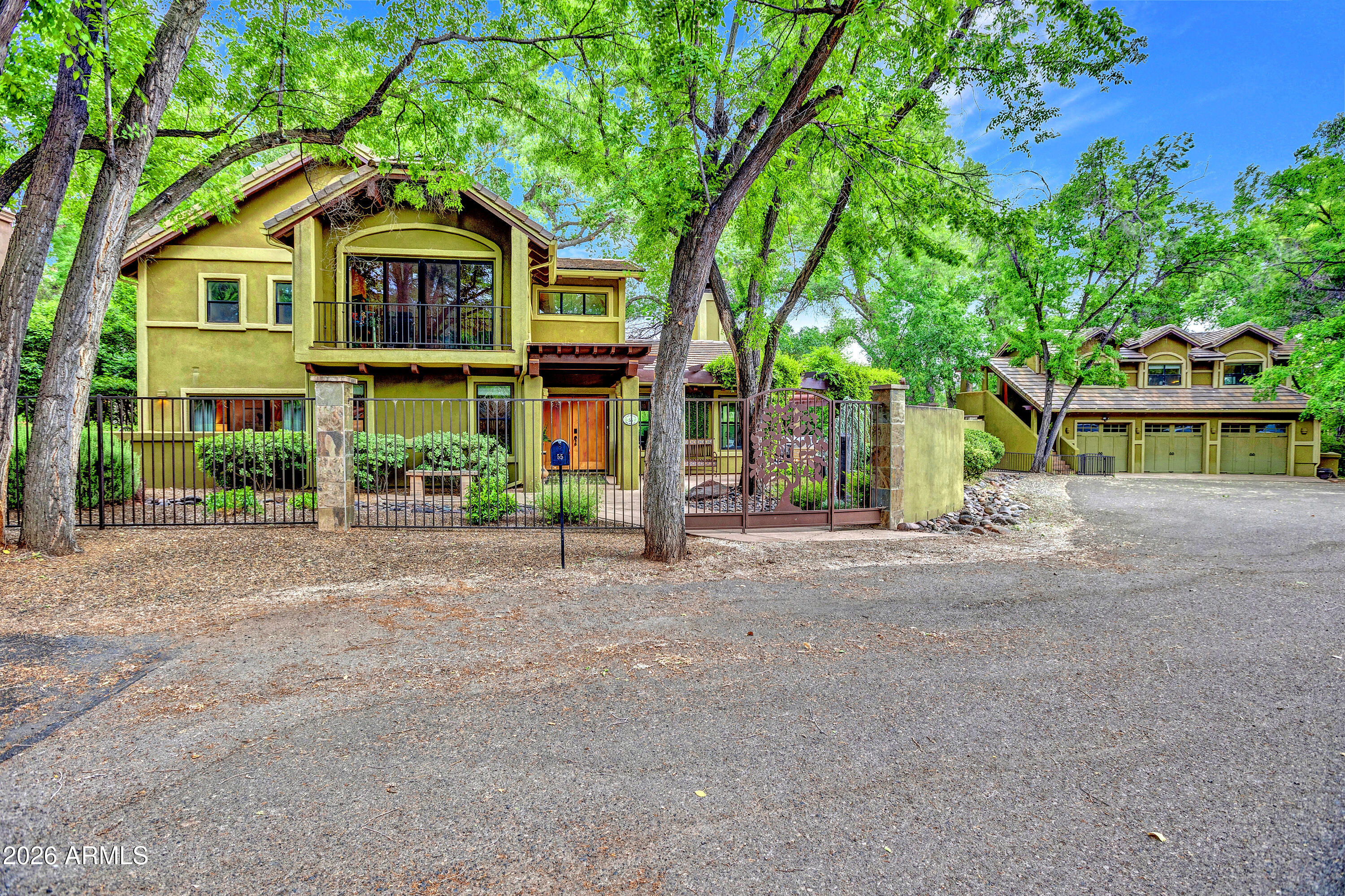 55 Ranch House Circle Sedona, AZ 86336 - Photo 60 of 61 a front view of a house with a yard and potted plants
