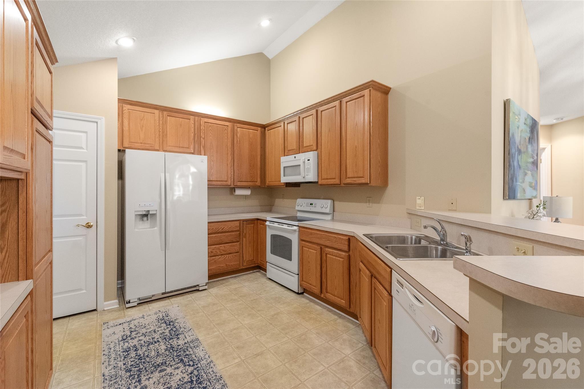 3052 Polo View Lane Matthews, NC 28105 - Photo 11 of 19 a kitchen with stainless steel appliances granite countertop a refrigerator sink and cabinets