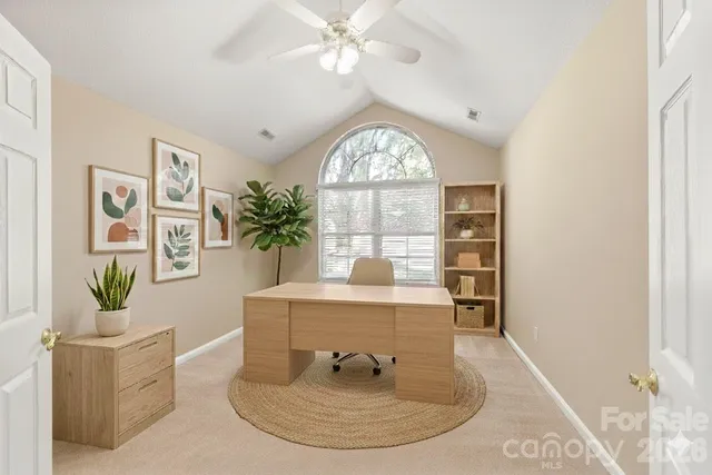 a view of a livingroom with furniture window and wooden floor