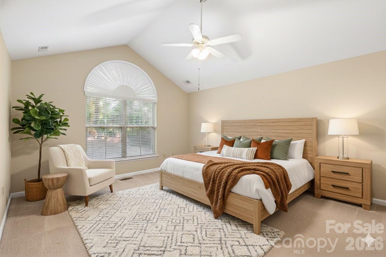 3052 Polo View Lane Matthews, NC 28105 - Photo 14 of 19 a bedroom with a large bed and a large window