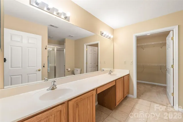 a bathroom with a double vanity sink mirror and double