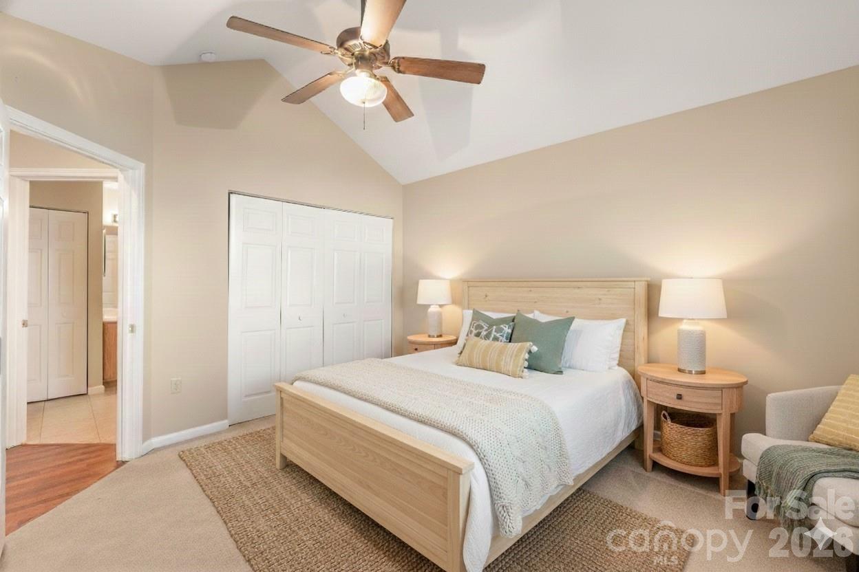 3052 Polo View Lane Matthews, NC 28105 - Photo 17 of 19 a bedroom with a bed and a chandelier