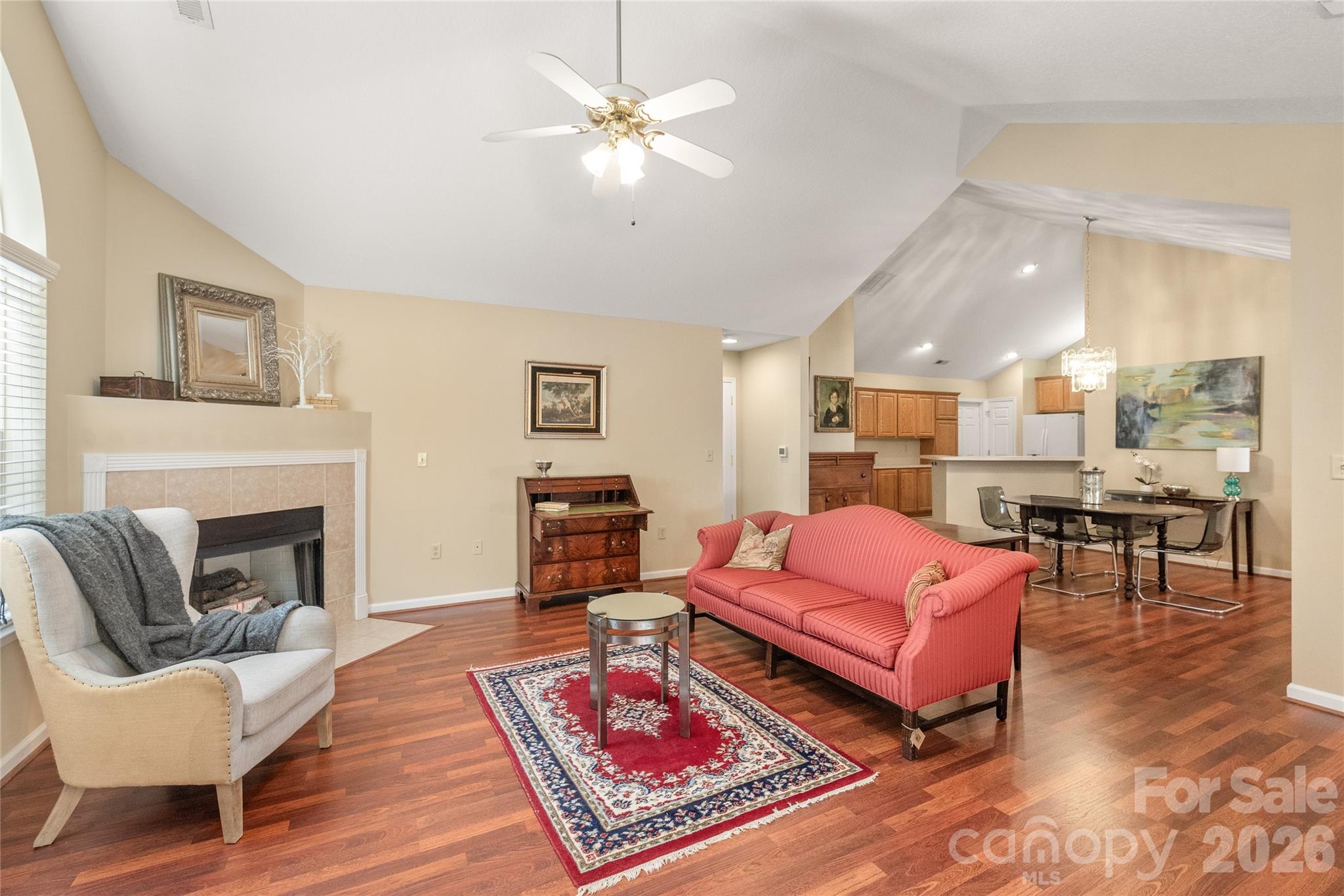 3052 Polo View Lane Matthews, NC 28105 - Photo 5 of 19 a living room with furniture a rug and a fireplace