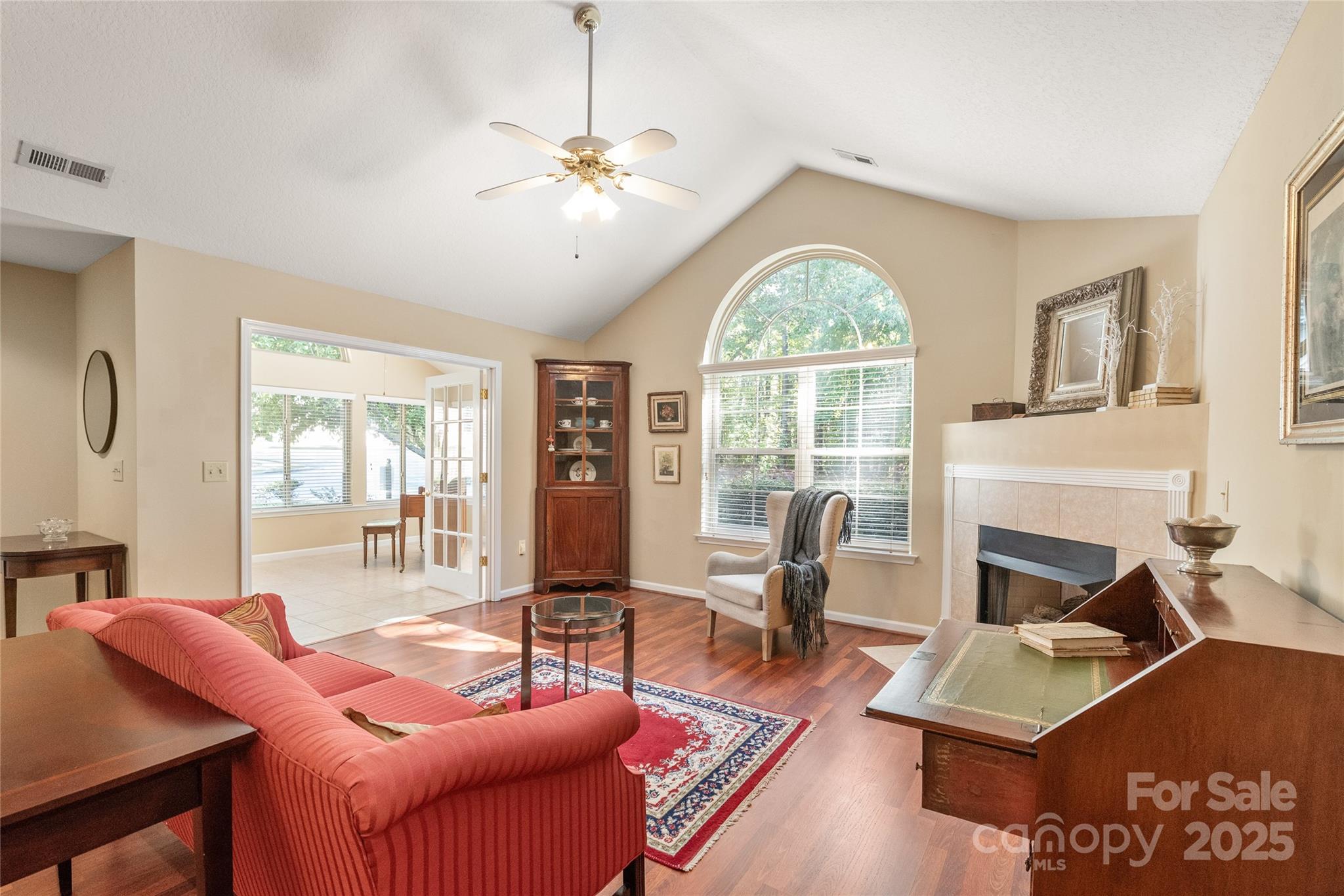 3052 Polo View Lane Matthews, NC 28105 - Photo 5 of 16 a living room with furniture a fireplace and large windows
