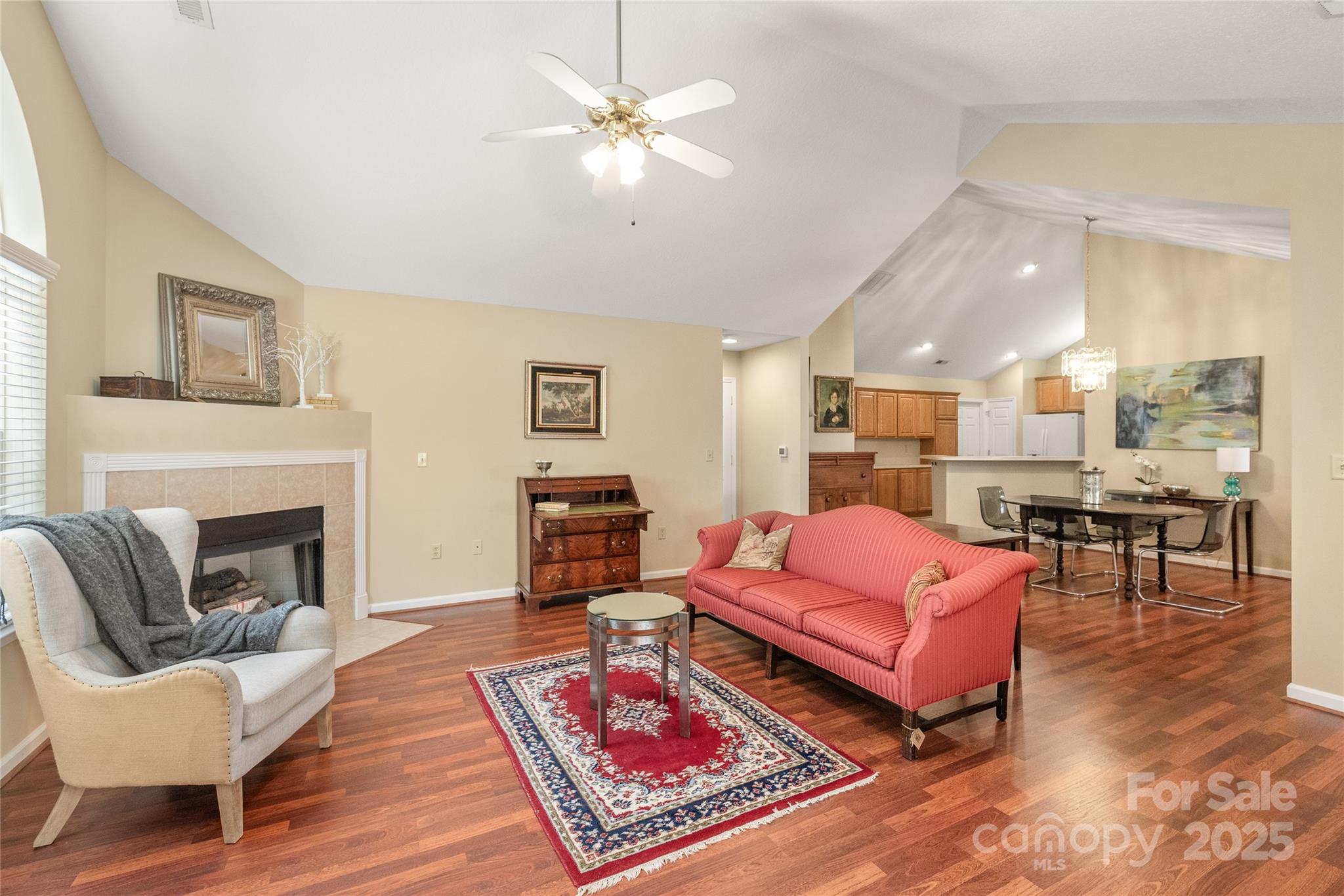 3052 Polo View Lane Matthews, NC 28105 - Photo 6 of 16 a living room with furniture a rug and a fireplace