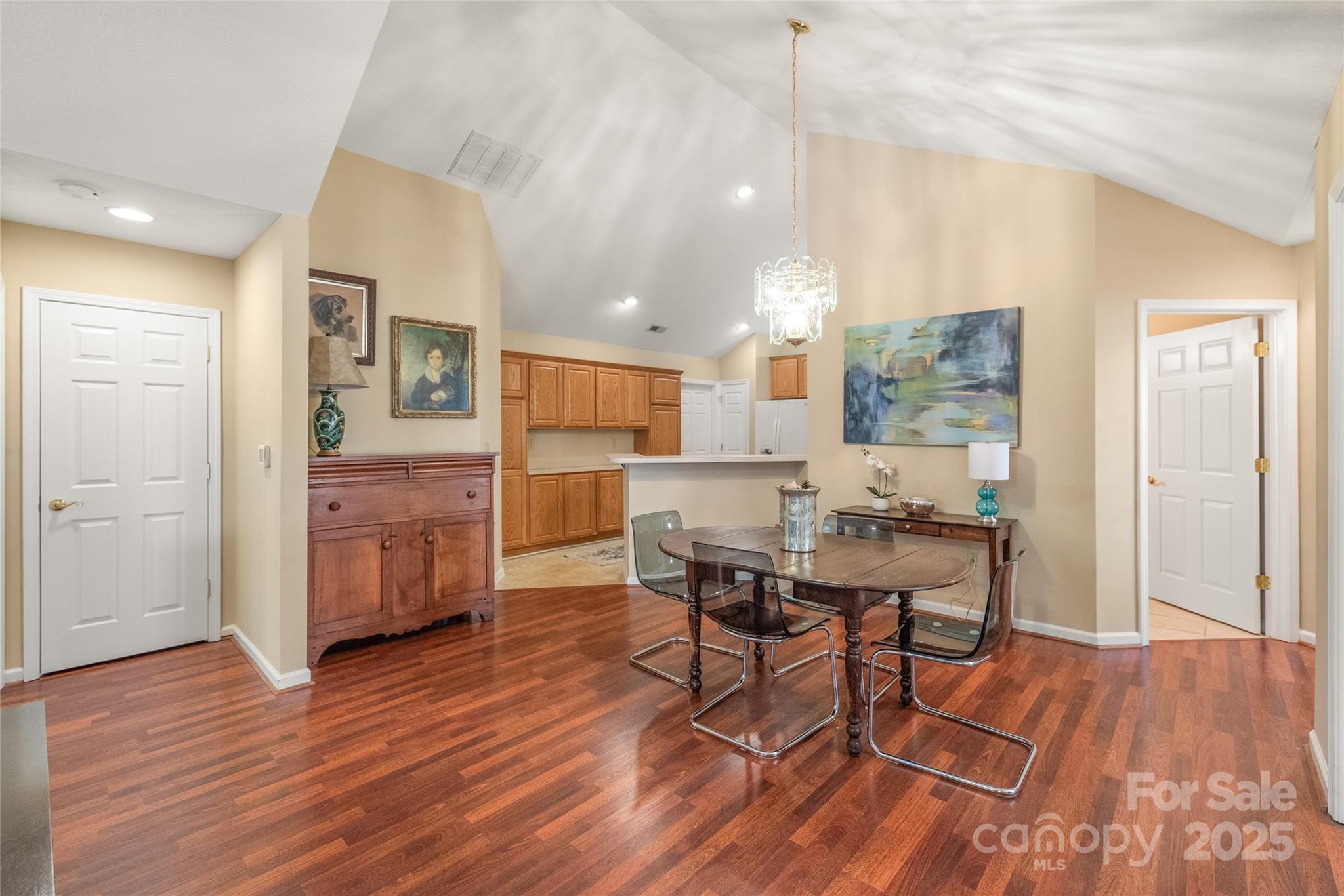 3052 Polo View Lane Matthews, NC 28105 - Photo 8 of 16 a dining room with furniture and wooden floor
