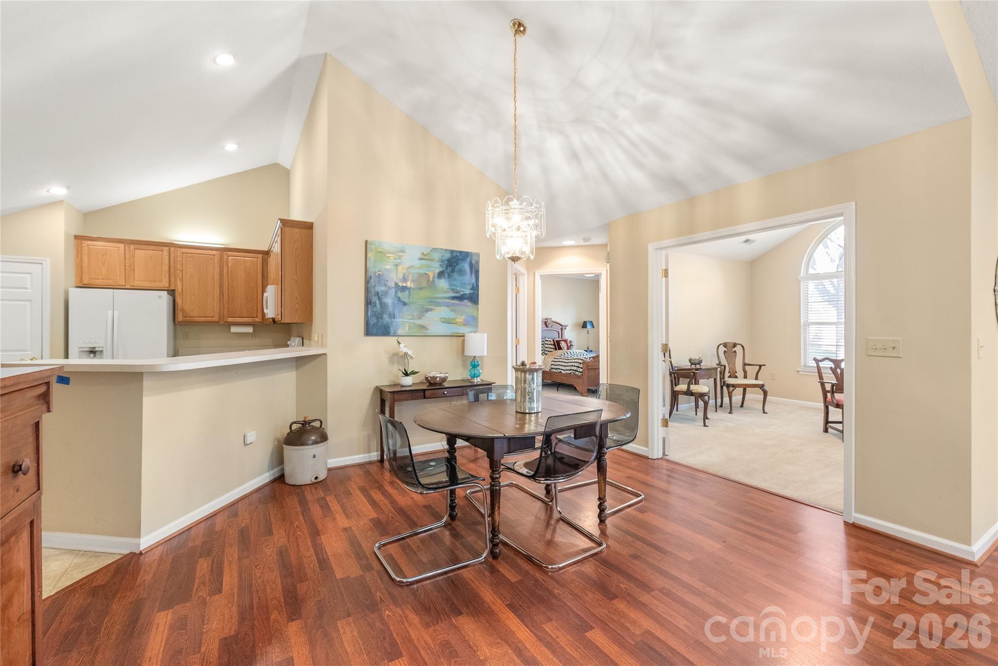 3052 Polo View Lane Matthews, NC 28105 - Photo 10 of 19 a view of a dining room with furniture and wooden floor