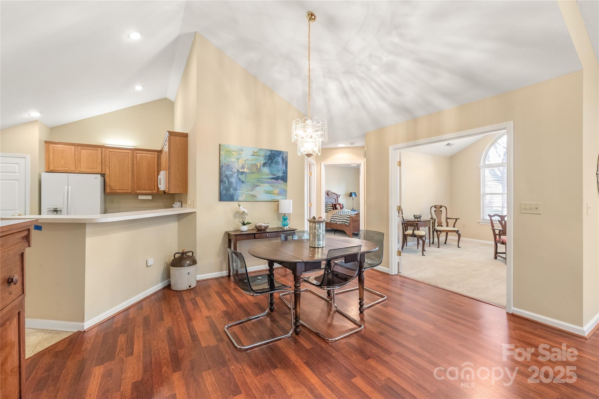 3052 Polo View Lane Matthews, NC 28105 - Photo 10 of 16 a view of a dining room with furniture and wooden floor