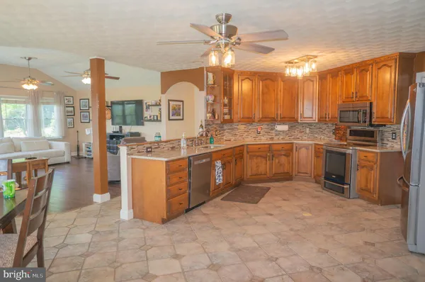 a kitchen with refrigerator and cabinets