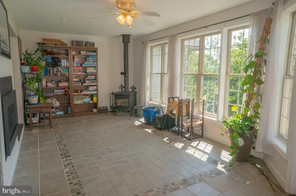 a view of a room with a mirror and a fan