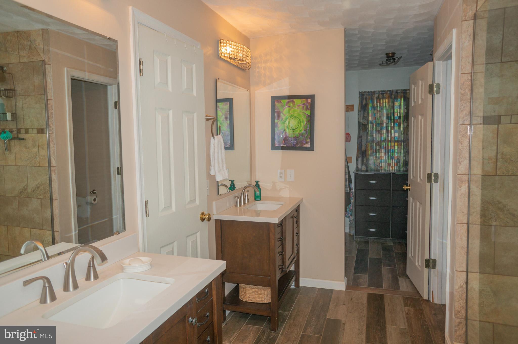 4815 Zeiglers Church Road Spring Grove, PA 17362 - Photo 38 of 122 a bathroom with a sink vanity granite tub and shower