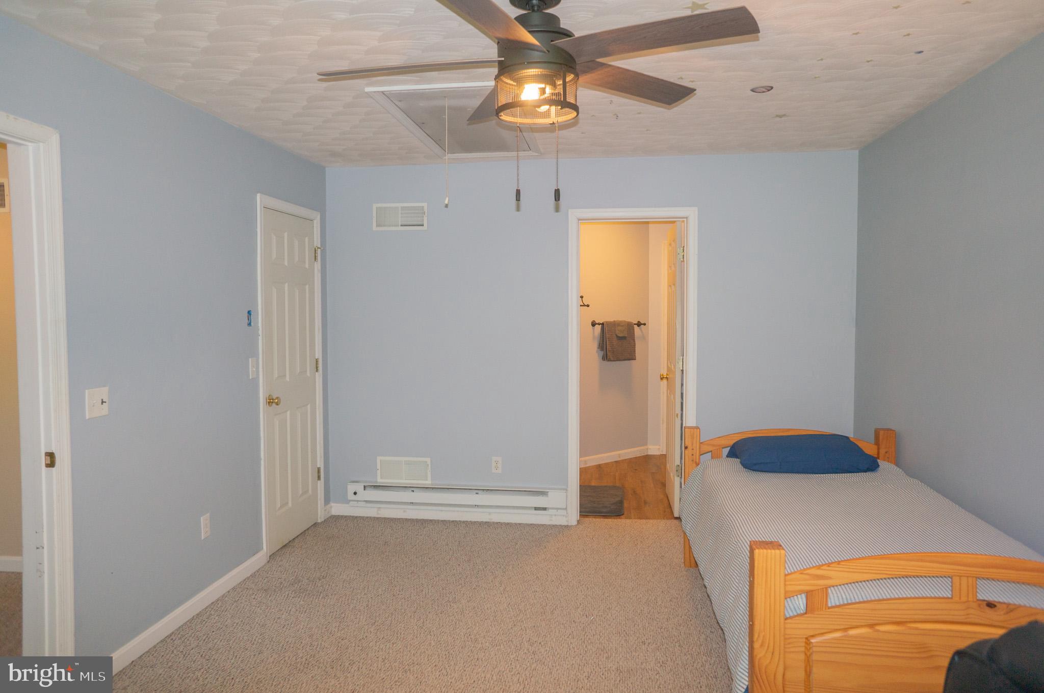 4815 Zeiglers Church Road Spring Grove, PA 17362 - Photo 51 of 122 a bedroom with a bed and a chandelier