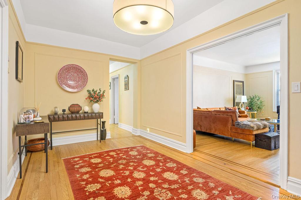 Hallway featuring light wood finished floors