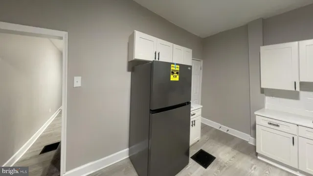 a kitchen with a refrigerator and a stove