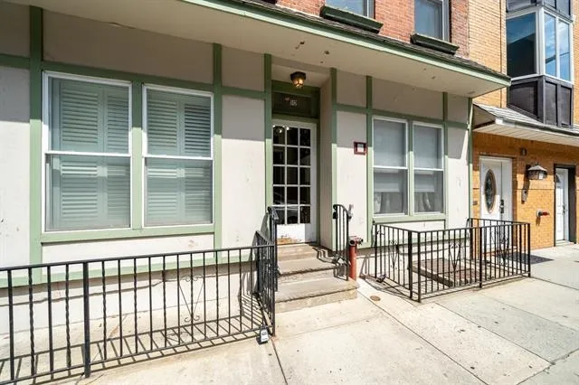 a view of a backyard with sitting area