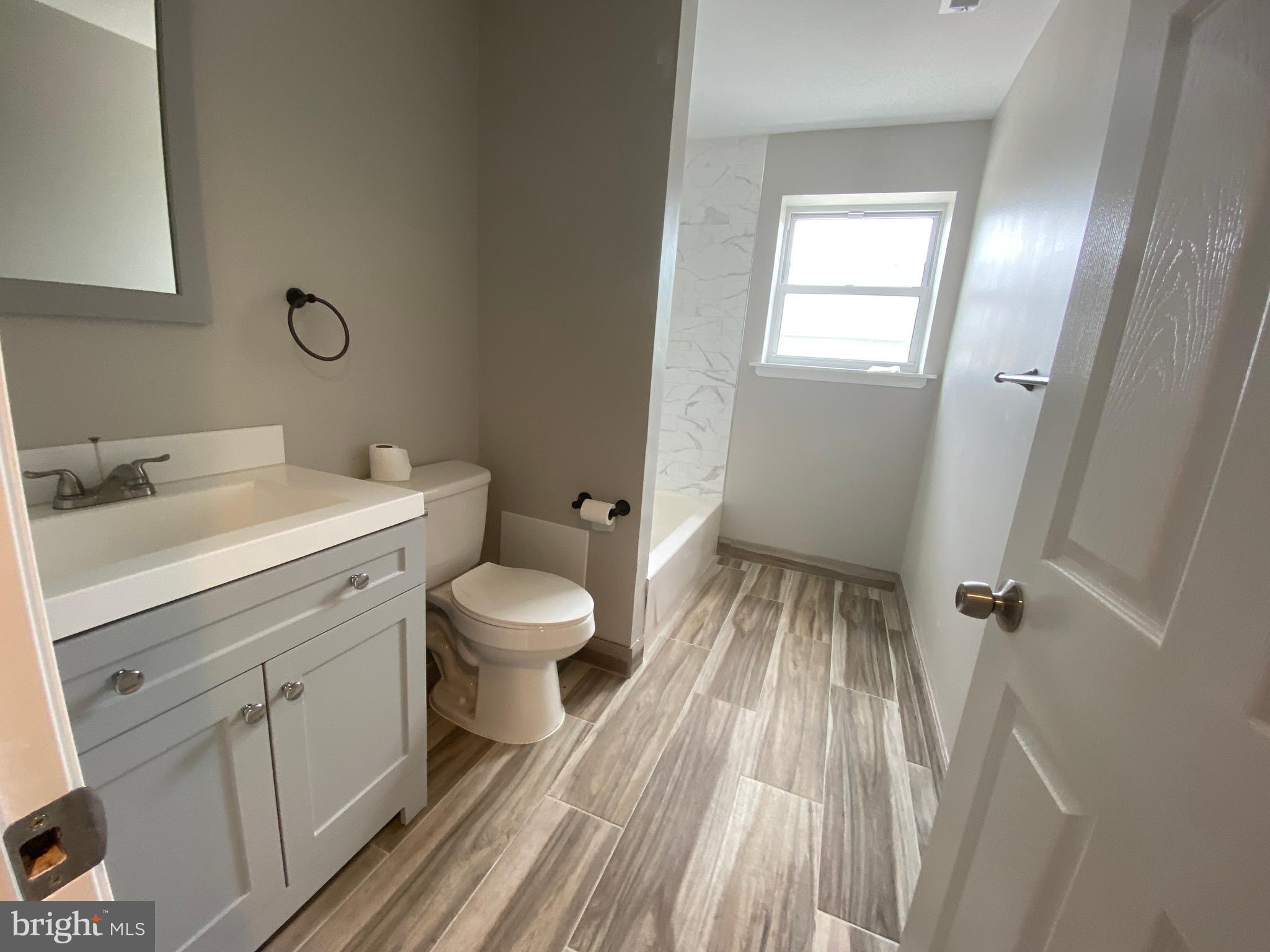 447 Diamond Street, Unit 2 Philadelphia, PA 19122 - Photo 9 of 18 a bathroom with a sink toilet and shower
