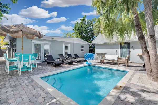 a view of a swimming pool with chairs