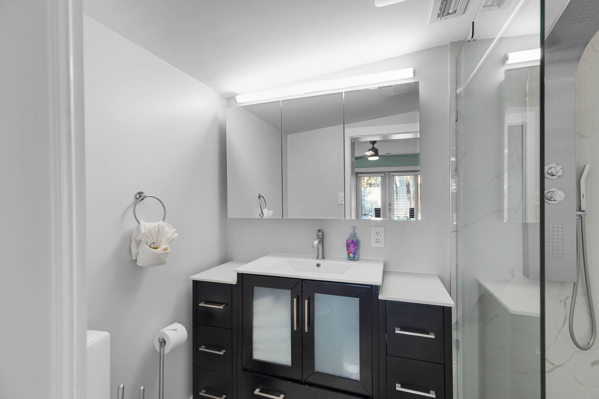 1707 George Street Key West, FL 33040 - Photo 13 of 39 a bathroom with a sink vanity and a mirror