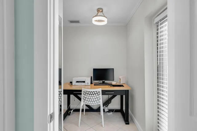 a workspace with furniture and a window