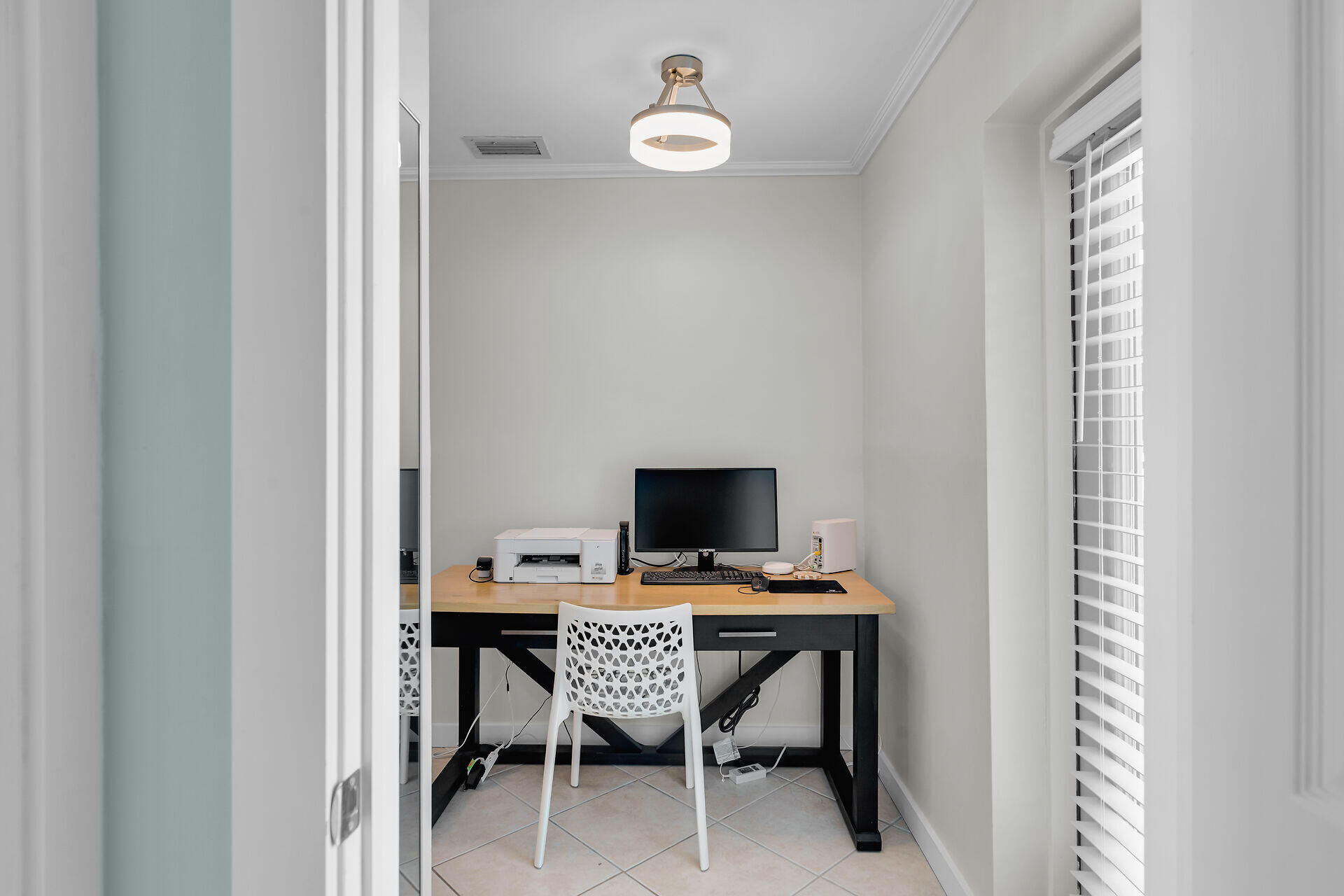 1707 George Street Key West, FL 33040 - Photo 14 of 39 a workspace with furniture and a window