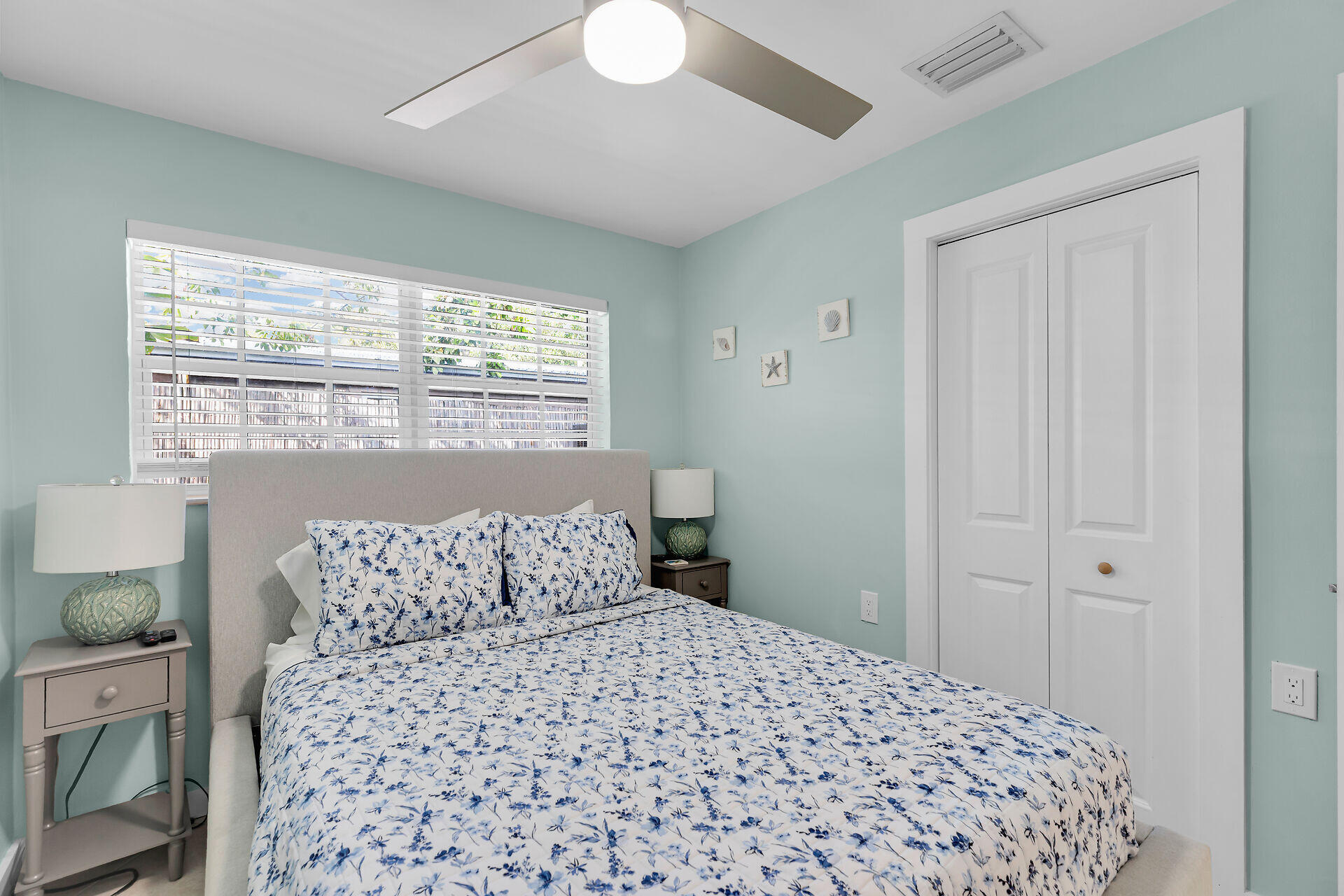 1707 George Street Key West, FL 33040 - Photo 17 of 39 a bedroom with a large bed and a chandelier
